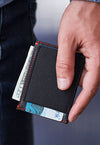 Man holding SLIMJIMMY wallet