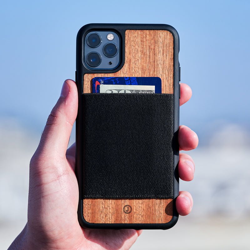 Close up of man's hand holding JIMMYCASE iPhone Wallet Case