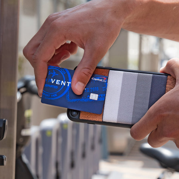 Man putting credit card into elastic pocket of JIMMYCASE iPhone Wallet Case
